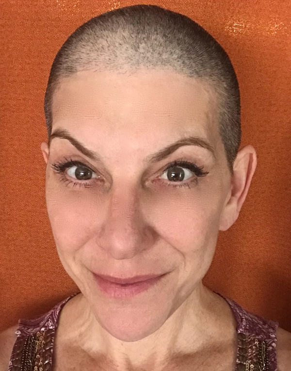 Sabrina Santa Clara portrait Portrait of a bald Sabrina Santa Clara smiling warmly