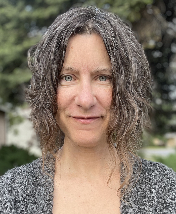 Andrea Feucht long hair Portrait of Andrea Feucht with long gray hair, gazing warmly