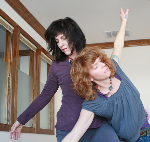 Contact improvisation movement Sabrina Santa Clara in a supportive contact improvisation, evoking authentic movement and dance therapy