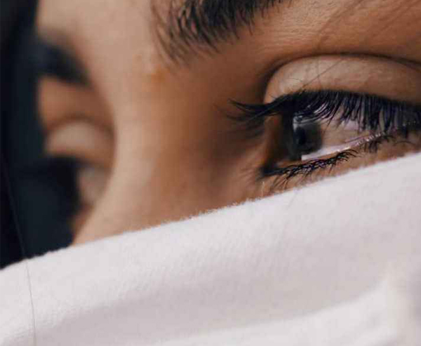 Eyes brimming with tears Close-up of a woman's eyes brimming with tears, evoking grief and deep emotion