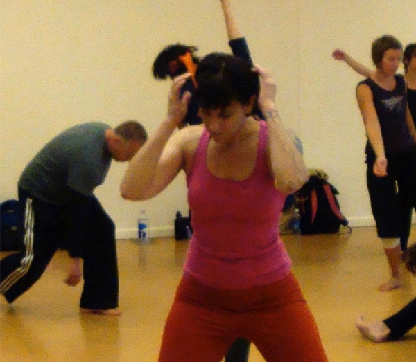 Group movement class Sabrna Santa Clara and others moving expressively in a group dance or authentic movement class
