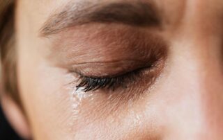 close up woman crying grief and sadness.