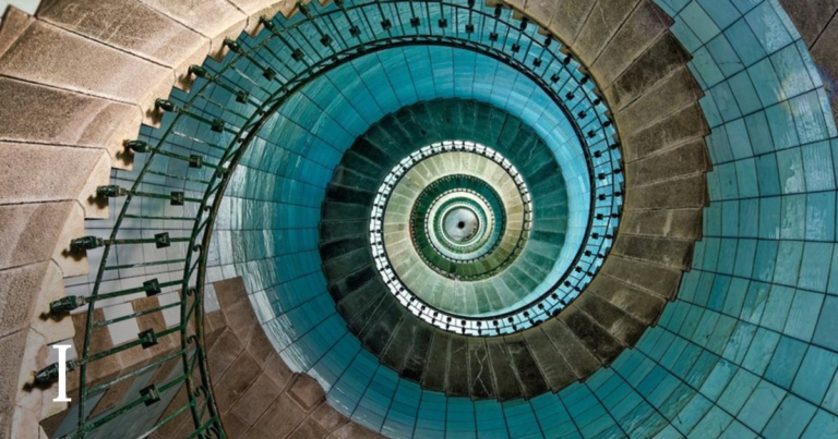 The lighthouse staircase seen from above with the roman numeral I in the lower left.