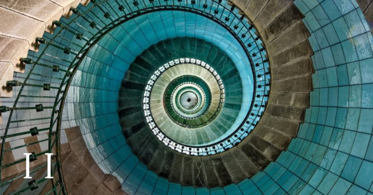 The lighthouse staircase seen from above, closer to the centre, with the roman numeral II in the lower left.
