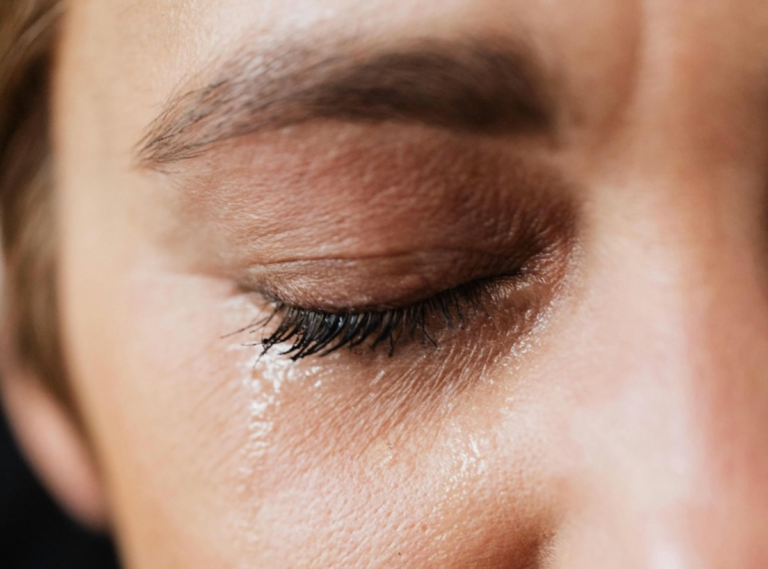 close up woman crying grief and sadness